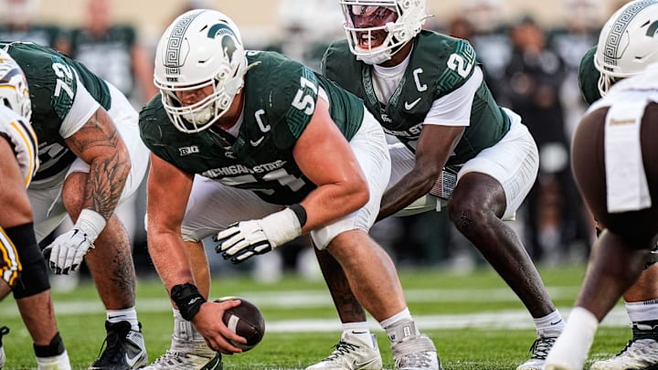 Michigan State quarterback Aidan Chiles (2) calls for a snap from offensive lineman Matt Gulbin (51) against Western Michigan during the first half at Spartan Stadium in East Lansing on Friday, August 29, 2025.