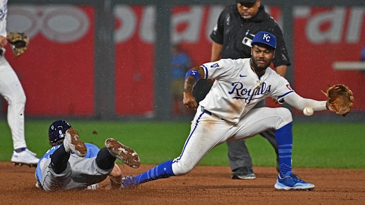 Jul 2, 2024; Kansas City, Missouri, USA; Tampa Bay Rays shortstop Taylor Walls (6) steals second base against Kansas City Royals second baseman Maikel Garcia (11) in the seventh inning at Kauffman Stadium. 