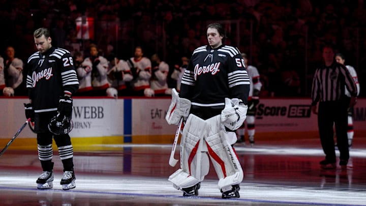 Apr 12, 2026; Newark, New Jersey, USA; New Jersey Devils goaltender Nico Daws (50) stands during the national anthem before the game against the Ottawa Senators at Prudential Center. Mandatory Credit: John Jones-Imagn Images