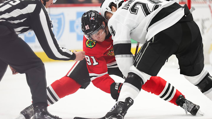 Mar 20, 2025; Chicago, Illinois, USA; Chicago Blackhawks center Frank Nazar (91) and Los Angeles Kings center Phillip Danault (24) face off during the second period at United Center. Mandatory Credit: Talia Sprague-Imagn Images