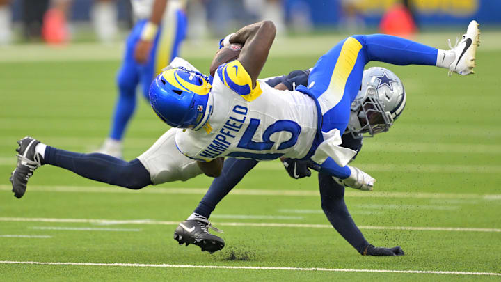 Aug 9, 2025; Inglewood, California, USA; Dallas Cowboys safety Mike Smith Jr. (39) stops Los Angeles Rams wide receiver Konata Mumpfield (15) after a complete pass during the second half at SoFi Stadium. Mandatory Credit: Jayne Kamin-Oncea-Imagn Images Aug 9, 2025; Inglewood, California, USA; Dallas Cowboys safety Mike Smith Jr. (39) stops Los Angeles Rams wide receiver Konata Mumpfield (15) after a complete pass during the second half at SoFi Stadium. Mandatory Credit: Jayne Kamin-Oncea-Imagn Images