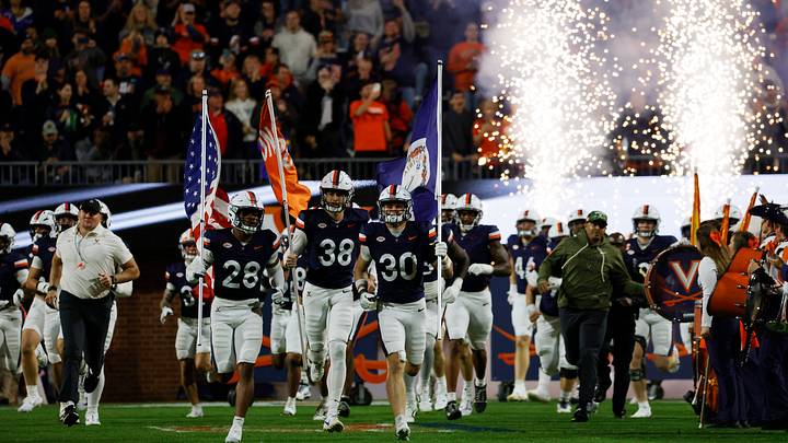 Nov 8, 2025; Charlottesville, Virginia, USA; Virginia Cavaliers players run onto the field prior to their game against the Wake Forest Demon Deacons at Scott Stadium. Mandatory Credit: Amber Searls-Imagn Images Nov 8, 2025; Charlottesville, Virginia, USA; Virginia Cavaliers players run onto the field prior to their game against the Wake Forest Demon Deacons at Scott Stadium. Mandatory Credit: Amber Searls-Imagn Images