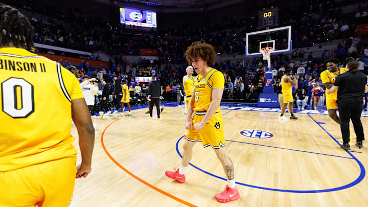 Jan 14, 2025; Gainesville, Florida, USA; Missouri Tigers guard T.O. Barrett (5) celebrates a win with Missouri Tigers guard Anthony Robinson II (0) after a game against the Florida Gators at Exactech Arena at the Stephen C. O'Connell Center. Mandatory Credit: Matt Pendleton-Imagn Images