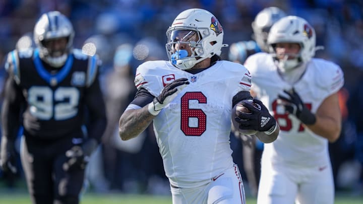 Dec 22, 2024; Charlotte, North Carolina, USA; Arizona Cardinals running back James Conner (6) runs for yardage against the Carolina Panthers during the second quarter at Bank of America Stadium. Mandatory Credit: Jim Dedmon-Imagn Images