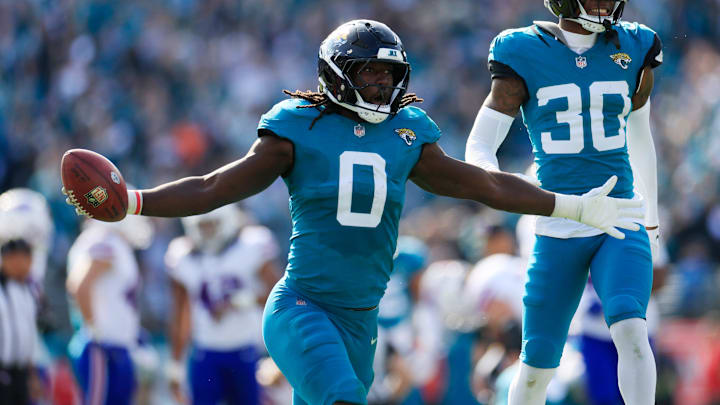 Jacksonville Jaguars linebacker Devin Lloyd (0) celebrates a fumble recovery with cornerback Montaric Brown (30) during the second quarter of an NFL football AFC Wild Card playoff matchup, Sunday, Jan. 11, 2026, in Jacksonville, Fla. [Corey Perrine/Florida Times-Union]