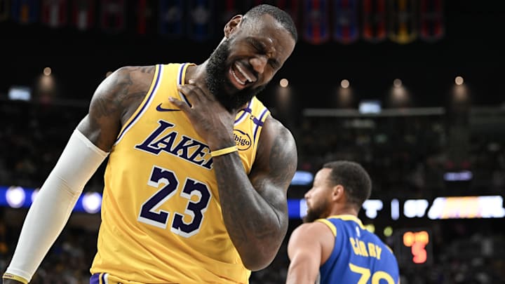 Los Angeles Lakers forward LeBron James (23) reacts to a play against the Golden State Warriors in the third quarter of their preseason game at T-Mobile Arena.
