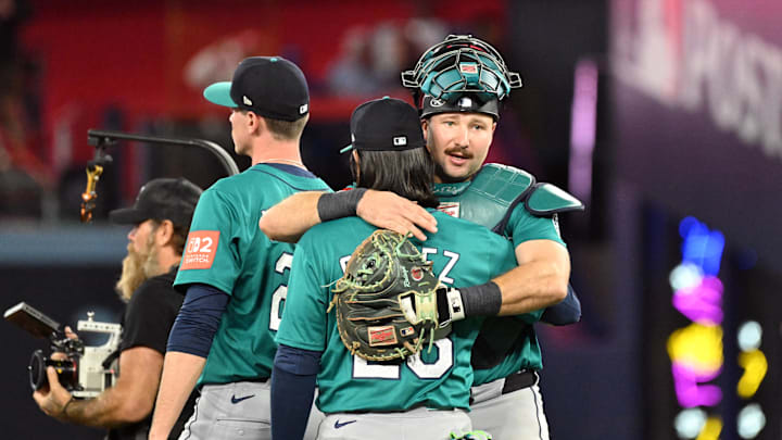 Oct 13, 2025; Toronto, Ontario, CAN; Seattle Mariners third baseman Eugenio Suarez (28) and catcher Cal Raleigh (29) celebrate after defeating the Toronto Blue Jays in game two of the ALCS round for the 2025 MLB playoffs at Rogers Centre. Mandatory Credit: Dan Hamilton-Imagn Images Oct 13, 2025; Toronto, Ontario, CAN; Seattle Mariners third baseman Eugenio Suarez (28) and catcher Cal Raleigh (29) celebrate after defeating the Toronto Blue Jays in game two of the ALCS round for the 2025 MLB playoffs at Rogers Centre. Mandatory Credit: Dan Hamilton-Imagn Images