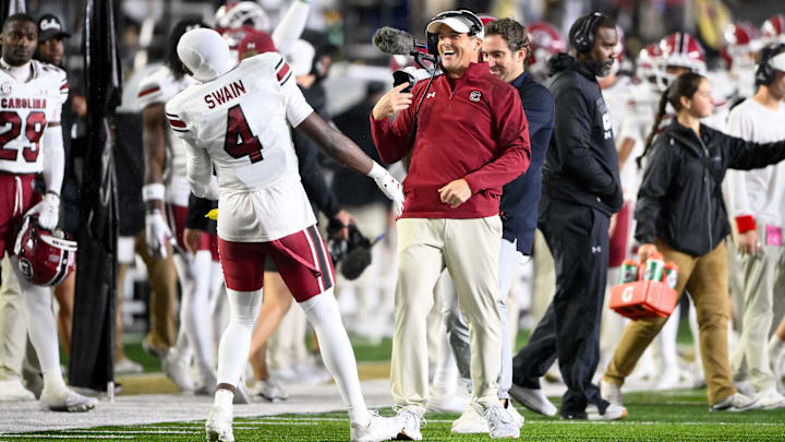 Nov 9, 2024; Nashville, Tennessee, USA;  South Carolina Gamecocks head coach Shane Beamer celebrates the win with defensive back Vicari Swain (4) against the Vanderbilt Commodores during the second half at FirstBank Stadium. Mandatory Credit: Steve Roberts-Imagn Images