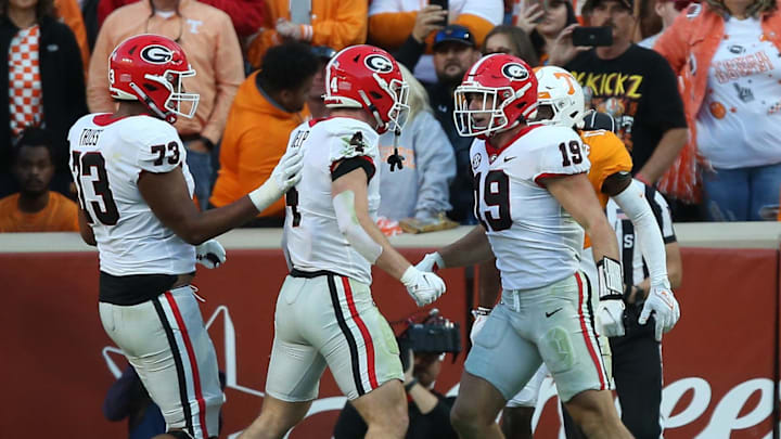 Nov 18, 2023; Knoxville, Tennessee, USA; Georgia Bulldogs tight end Brock Bowers (19) celebrates after scoring a touchdown against Tennessee Volunteers defensive back Jaylen McCollough (2) during the first half at Neyland Stadium. Mandatory Credit: Randy Sartin-Imagn Images