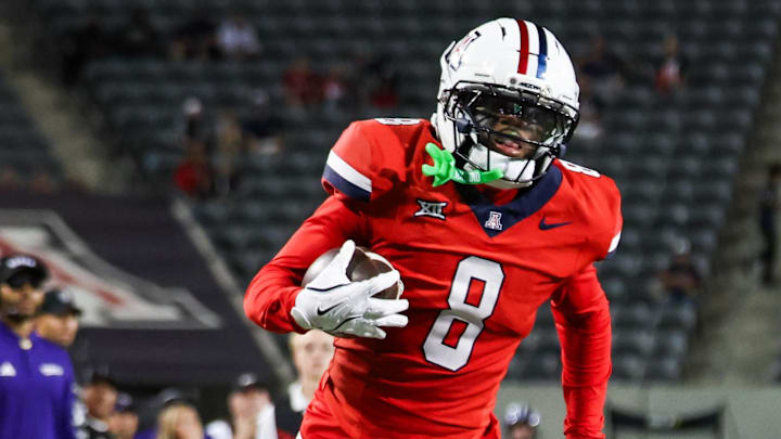 Sep 6, 2025; Tucson, Arizona, USA; Arizona Wildcats defensive back Jay’Vion Cole (8) intercepts the ball and runs it for a touchdown during the third quarter against the Weber State Wildcats at Arizona Stadium. Mandatory Credit: Aryanna Frank-Imagn Images