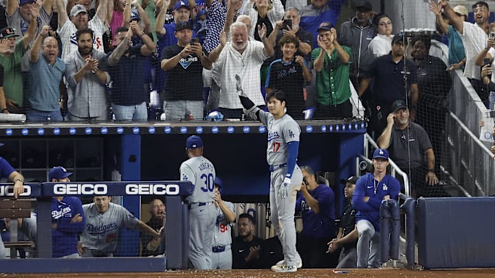 Sep 19, 2024; Miami, Florida, USA; Los Angeles Dodgers designated hitter Shohei Ohtani (17) reacts to a standing ovation from the fans after hitting his 50th home run of the season against the Miami Marlins during the seventh inning at loanDepot Park. Mandatory Credit: Rhona Wise-Imagn Images