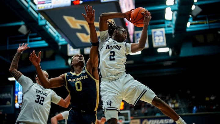 University of Toledo’s Leroy Blyden Jr. (2) grabs a rebound over University of Akron’s Amani Lyles (0), Jan. 27, 2026, at James A Rhodes Arena in Akron, Ohio.