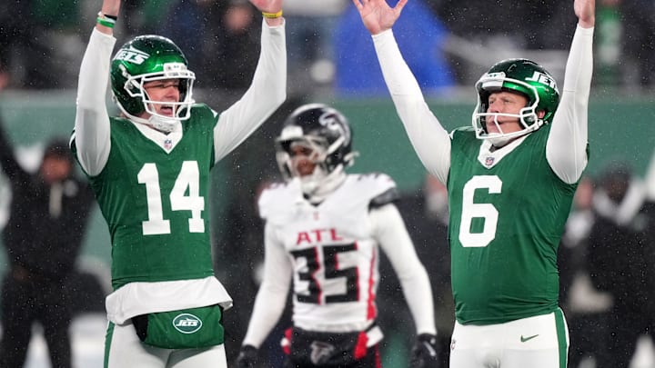 Atlanta Falcons CB Natrone Brooks looks on in the background as the New York Jets celebrated a game-winning kick on Sunday.