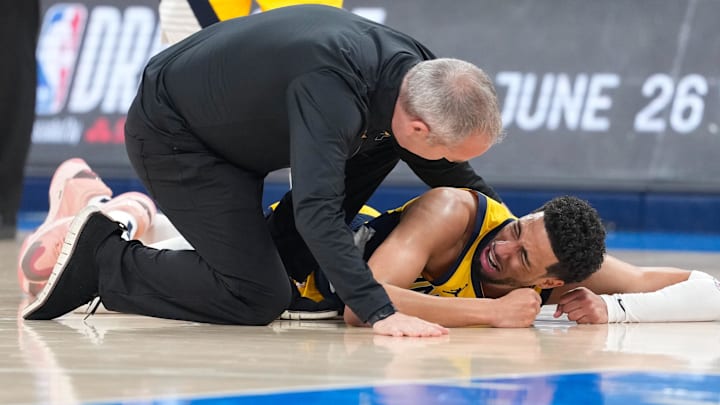 Jun 22, 2025; Oklahoma City, Oklahoma, USA; Indiana Pacers guard Tyrese Haliburton (0) reacts after suffering an injury during the first quarter against the Oklahoma City Thunder during game seven of the 2025 NBA Finals at Paycom Center. Mandatory Credit: Kyle Terada-Imagn Images