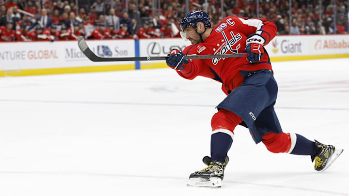 Mar 7, 2025; Washington, District of Columbia, USA; Washington Capitals left wing Alex Ovechkin (8) shoots the puck against the Detroit Red Wings in the third period at Capital One Arena. Mandatory Credit: Geoff Burke-Imagn Images