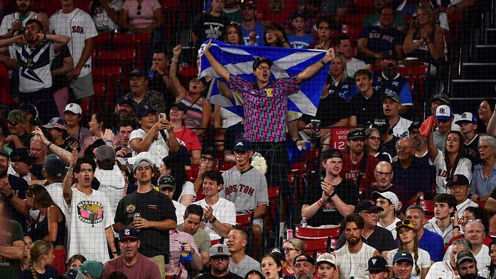 Jun 14, 2026; Boston, Massachusetts, USA; A fan holds a Scottish flag during the eighth inning in a game between the Boston Red Sox and Texas Rangers at Fenway Park. Mandatory Credit: Bob DeChiara-Imagn Images Jun 14, 2026; Boston, Massachusetts, USA; A fan holds a Scottish flag during the eighth inning in a game between the Boston Red Sox and Texas Rangers at Fenway Park. Mandatory Credit: Bob DeChiara-Imagn Images