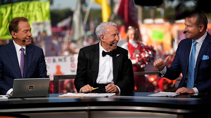 Lee Corso, middle, talks to Kirk Herbstreit, right, and Nick Saban on the set of ESPN College GameDay prior to the NCAA football game between the Ohio State Buckeyes and the Texas Longhorns at Ohio Stadium on Aug. 30, 2025.