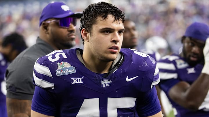 Dec 26, 2024; Phoenix, AZ, USA; Kansas State Wildcats linebacker Austin Romaine (45) against the Rutgers Scarlet Knights during the Rate Bowl at Chase Field. Mandatory Credit: Mark J. Rebilas-Imagn Images Dec 26, 2024; Phoenix, AZ, USA; Kansas State Wildcats linebacker Austin Romaine (45) against the Rutgers Scarlet Knights during the Rate Bowl at Chase Field. Mandatory Credit: Mark J. Rebilas-Imagn Images