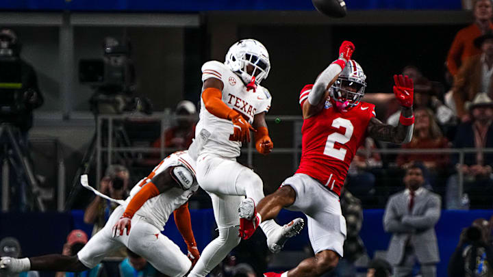 Ohio State receiver Emeka Egbuka (2) has a catch broken up by Texas Longhorns defensive back Jahdae Barron (7) during the College Football Playoff semifinal game in the Cotton Bowl at AT&T Stadium on Friday, Jan. 10, 2024 in Arlington, Texas.