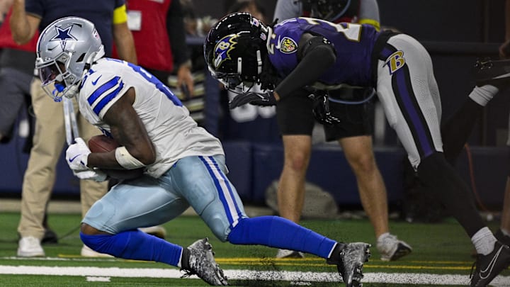 Dallas Cowboys wide receiver Jonathan Mingo catches a pass in front of Baltimore Ravens cornerback T.J. Tampa. Dallas Cowboys wide receiver Jonathan Mingo catches a pass in front of Baltimore Ravens cornerback T.J. Tampa.