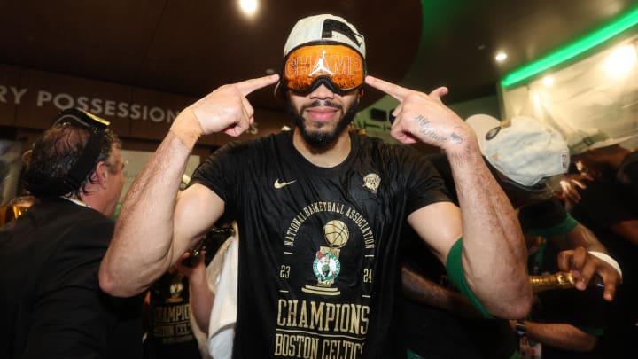 Jun 17, 2024; Boston, Massachusetts, USA; Boston Celtics forward Jayson Tatum (0) celebrates in the locker room after winning the 2024 NBA Finals against the Dallas Mavericks at TD Garden. 
