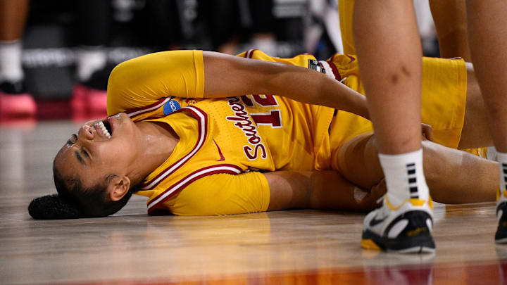 Watkins was carried off the court with an apparent knee injury in the first quarter of the Trojans‘ win over Mississippi State. 