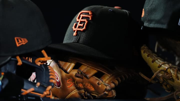 General view of San Francisco Giants caps and gloves. General view of San Francisco Giants caps and gloves.