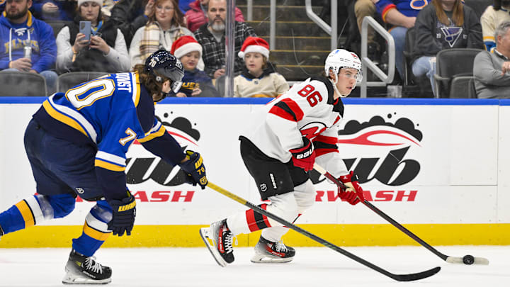 Dec 17, 2024; St. Louis, Missouri, USA; New Jersey Devils center Jack Hughes (86) controls the puck as St. Louis Blues center Oskar Sundqvist (70) defends during the first period at Enterprise Center. Mandatory Credit: Jeff Curry-Imagn Images Dec 17, 2024; St. Louis, Missouri, USA; New Jersey Devils center Jack Hughes (86) controls the puck as St. Louis Blues center Oskar Sundqvist (70) defends during the first period at Enterprise Center. Mandatory Credit: Jeff Curry-Imagn Images