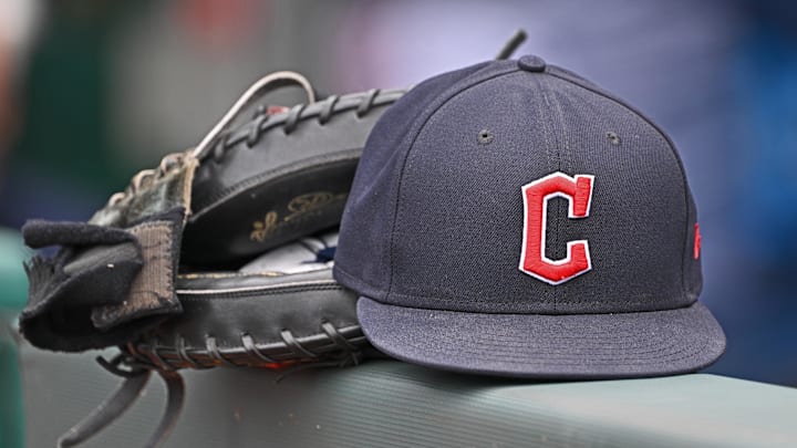 Jun 27, 2024; Kansas City, Missouri, USA; A general view a Cleveland Guardians hat and glove on the dugout railing before a game against the Kansas City Royals at Kauffman Stadium. Mandatory Credit: Peter Aiken-Imagn Images Jun 27, 2024; Kansas City, Missouri, USA; A general view a Cleveland Guardians hat and glove on the dugout railing before a game against the Kansas City Royals at Kauffman Stadium. Mandatory Credit: Peter Aiken-Imagn Images