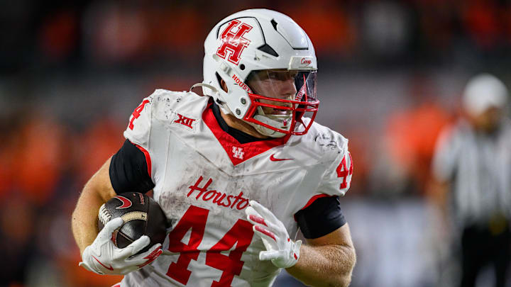 Houston Cougars running back Dean Connors (44) runs the ball for a first down in overtime against the Oregon State Beavers at Reser Stadium.