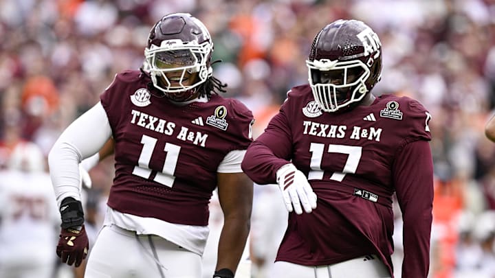 Texas A&M Aggies defensive tackle Albert Regis (17) and defensive tackle Tyler Onyedim (11) celebrate during the game between the Aggies and the Hurricanes at Kyle Field.