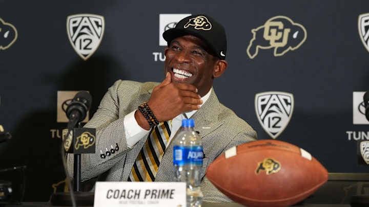 Dec 4, 2022; Boulder, CO, USA; Colorado Buffaloes head coach Deion Sanders reacts during a press conference at the Arrow Touchdown Club. Mandatory Credit: Ron Chenoy-Imagn Images