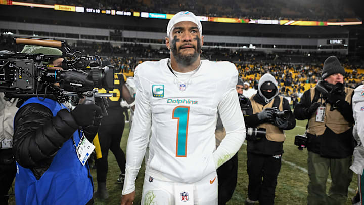 Miami Dolphins quarterback Tua Tagovailoa (1) leaves the  field following a game against the Pittsburgh Steelers at Acrisure Stadium in his last start of the 2025 season.