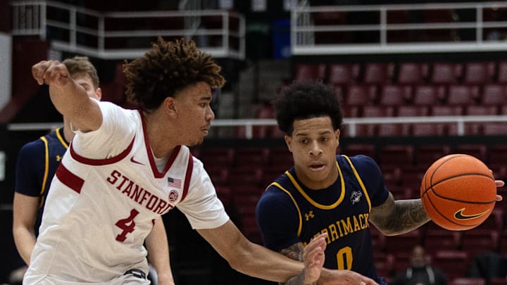 Dec 17, 2024; Stanford, California, USA; Merrimack Warriors guard Adam Clark (0) attempts to drive past Stanford Cardinal guard Oziyah Sellers (4) during the first half at Maples Pavilion. Mandatory Credit: D. Ross Cameron-Imagn Images Dec 17, 2024; Stanford, California, USA; Merrimack Warriors guard Adam Clark (0) attempts to drive past Stanford Cardinal guard Oziyah Sellers (4) during the first half at Maples Pavilion. Mandatory Credit: D. Ross Cameron-Imagn Images