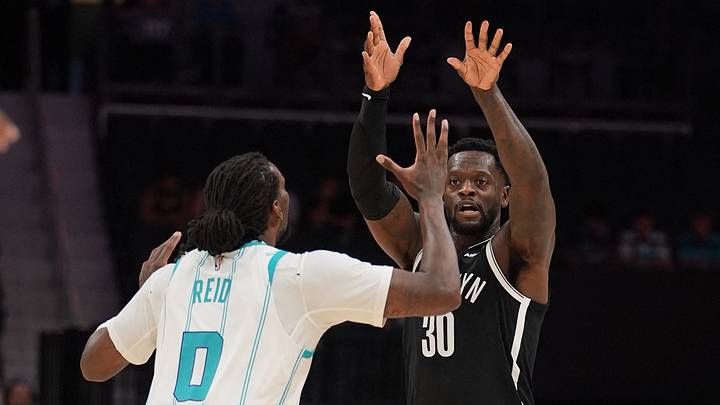 Oct 6, 2026; Charlotte, North Carolina, USA; Brooklyn Nets forward Julius Randle (30) passes the ball over Charlotte Hornets center Naz Reid (0) during the first quarter at Spectrum Center. Mandatory Credit: Jim Dedmon-Imagn Images Oct 6, 2026; Charlotte, North Carolina, USA; Brooklyn Nets forward Julius Randle (30) passes the ball over Charlotte Hornets center Naz Reid (0) during the first quarter at Spectrum Center. Mandatory Credit: Jim Dedmon-Imagn Images