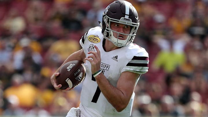 Jan 1, 2019; Tampa, FL, USA;Mississippi State Bulldogs quarterback Nick Fitzgerald (7) runs with the ball against the Iowa Hawkeyes during the second half in the 2019 Outback Bowl at Raymond James Stadium. Mandatory Credit: Kim Klement-Imagn Images