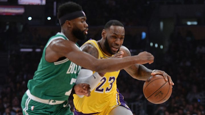 March 9, 2019; Los Angeles, CA, USA; Los Angeles Lakers forward LeBron James (23) moves the ball against Boston Celtics guard Jaylen Brown (7) during the first half at Staples Center. Mandatory Credit: Gary A. Vasquez-Imagn Images