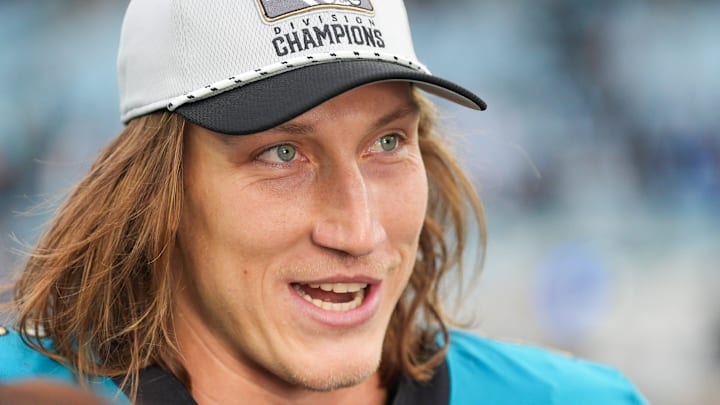 Jacksonville Jaguars quarterback Trevor Lawrence (16) proudly wears his AFC South Division Champions hat during the fourth quarter in an NFL football matchup at EverBank Stadium, Sunday, Jan. 4, 2026, in Jacksonville, Fla. The Jaguars defeated the Titans 41-7 [Doug Engle/Florida Times-Union]