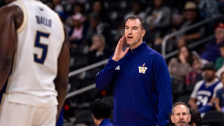 Washington Huskies head coach Danny Sprinkle talks to his players from the bench area during the second half of their game in the Acrisure Series in Palm Desert, Calif., Thursday, Nov. 27, 2025. Washington Huskies head coach Danny Sprinkle talks to his players from the bench area during the second half of their game in the Acrisure Series in Palm Desert, Calif., Thursday, Nov. 27, 2025.