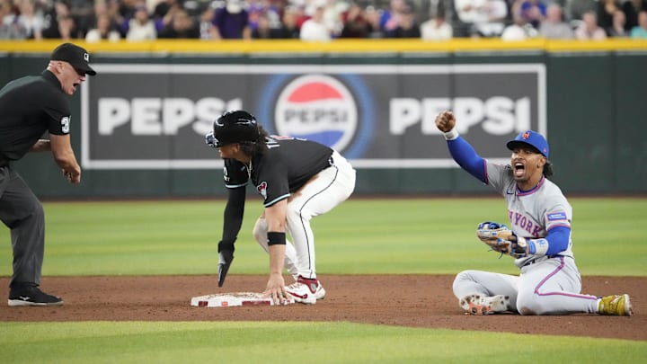 Arizona Diamondbacks Alek Thomas (5) is called out trying to steal second by umpire Ryan Blakney (36) as New York Mets shortstop Francisco Lindor (12) reacts during the ninth inning at Chase Field, May 5, 2025. Arizona Diamondbacks Alek Thomas (5) is called out trying to steal second by umpire Ryan Blakney (36) as New York Mets shortstop Francisco Lindor (12) reacts during the ninth inning at Chase Field, May 5, 2025.