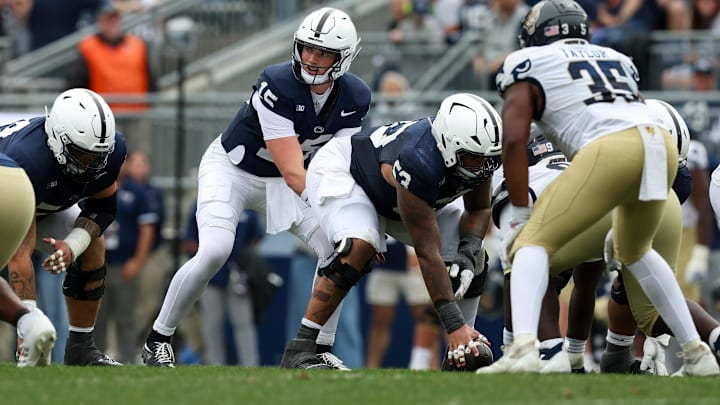 Penn State Nittany Lions quarterback Drew Allar (15) lines up behind center Nick Dawkins (53) during the third quarter against the FIU Panthers at Beaver Stadium. 