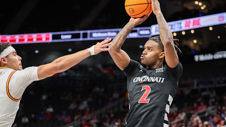 Mar 12, 2025; Kansas City, MO, USA; Cincinnati Bearcats guard Jizzle James (2) shoots the ball during the second half against the Iowa State Cyclones at T-Mobile Center. Mandatory Credit: William Purnell-Imagn Images Mar 12, 2025; Kansas City, MO, USA; Cincinnati Bearcats guard Jizzle James (2) shoots the ball during the second half against the Iowa State Cyclones at T-Mobile Center. Mandatory Credit: William Purnell-Imagn Images