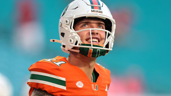 Miami Hurricanes quarterback Carson Beck (11) looks on from the field before the game against the Louisville Cardinals at Hard Rock Stadium.