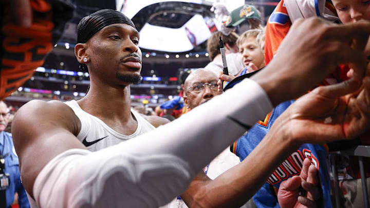 Mar 3, 2026; Chicago, Illinois, USA; Oklahoma City Thunder guard Shai Gilgeous-Alexander (2) signs autographs before an NBA game against the Chicago Bulls at United Center. Mandatory Credit: Kamil Krzaczynski-Imagn Images