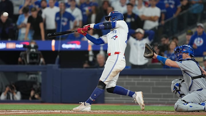 Clement hitting a double in a white uniform during game seven of the world serie