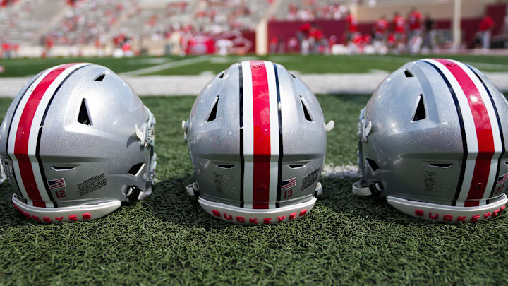 Sep 2, 2023; Bloomington, Indiana, USA; Ohio State Buckeyes helmets sit on the sideline prior to the NCAA football game at Indiana University Memorial Stadium.