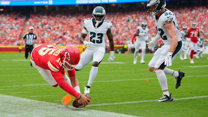 Sep 14, 2025; Kansas City, Missouri, USA; Kansas City Chiefs quarterback Patrick Mahomes (15) scores a touchdown defended by Philadelphia Eagles cornerback Jakorian Bennett (23) and defensive end Za'Darius Smith (52) during the second quarter of the game at GEHA Field at Arrowhead Stadium. Mandatory Credit: Jay Biggerstaff-Imagn Images Sep 14, 2025; Kansas City, Missouri, USA; Kansas City Chiefs quarterback Patrick Mahomes (15) scores a touchdown defended by Philadelphia Eagles cornerback Jakorian Bennett (23) and defensive end Za'Darius Smith (52) during the second quarter of the game at GEHA Field at Arrowhead Stadium. Mandatory Credit: Jay Biggerstaff-Imagn Images