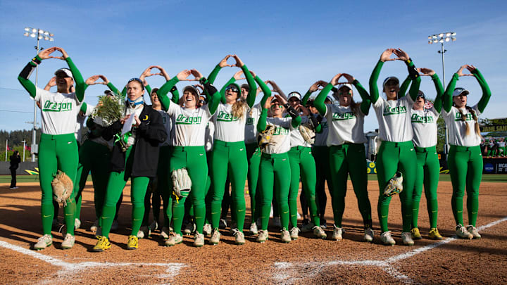 Oregon players celebrate their victory over Oregon State with fans at Jane Sanders Stadium.