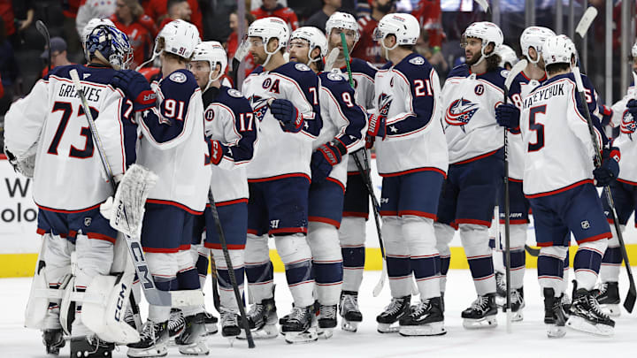 Apr 13, 2025; Washington, District of Columbia, USA; Columbus Blue Jackets goaltender Jet Greaves (73) celebrates with teammates after their game against the Washington Capitals at Capital One Arena. Mandatory Credit: Geoff Burke-Imagn Images