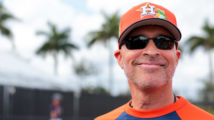 Houston Astros manager Joe Espada (19) speaks to reporters before a spring training workout.